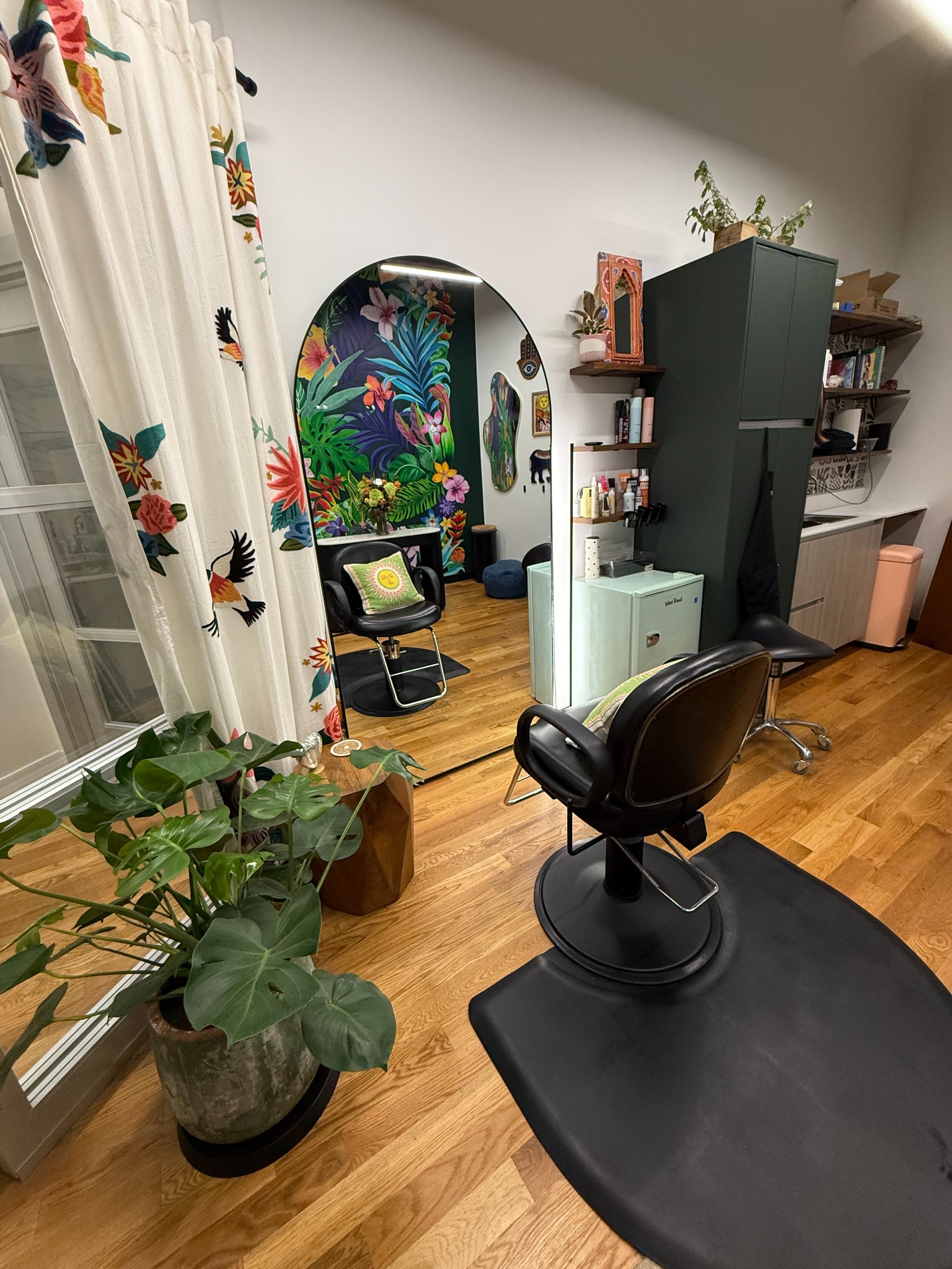 Bright, colorful private hair studio with styling chairs